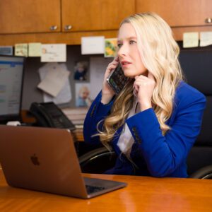 Personal injury lawyer Julie Reasonover at her desk on the phone