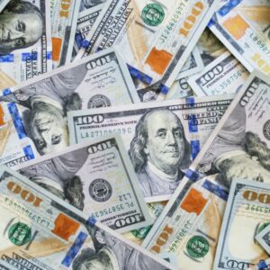 Collage of $100 bills to reflect compensation from personal injury claim
