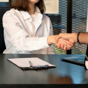 Attorney shaking hands with truck accident client