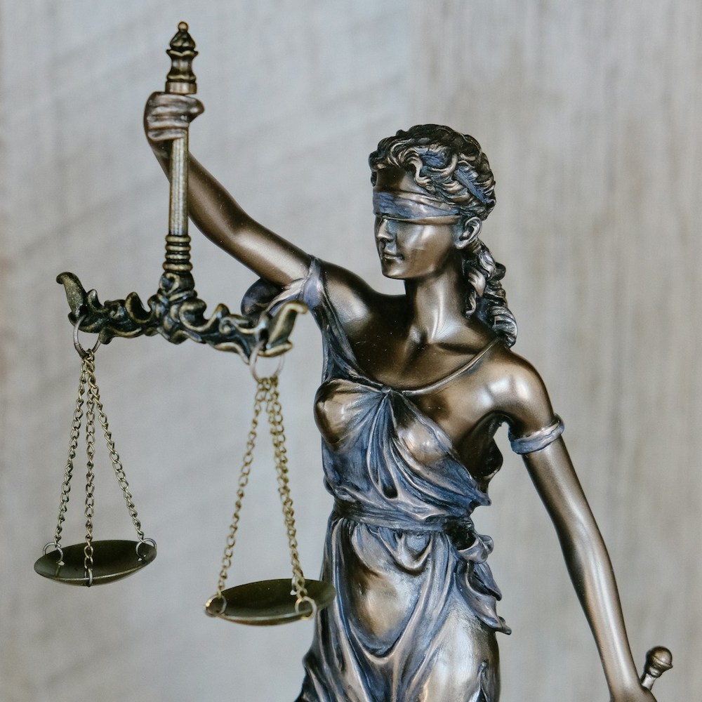 page-wrongful-death-justice Scales of justice statue